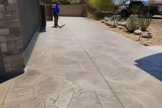 Stamped concrete surface with stone texture and prickly pear cactus in Phoenix, AZ.