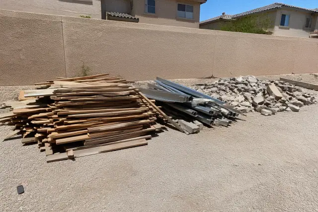Sorted construction waste including wood, metal, and masonry pieces at a jobsite in Phoenix, AZ.