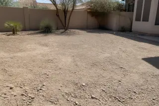 Compact aggregate fill inside a former swimming pool basin at a residential site in Phoenix, AZ.