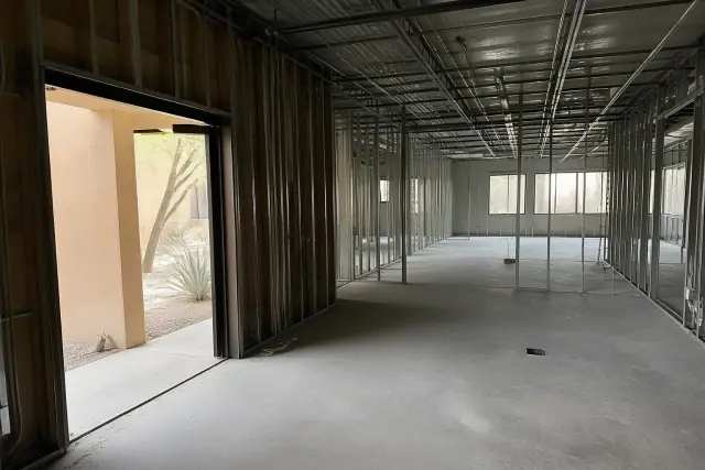 Interior of a commercial office space during a pre-demolition site walk in Phoenix, AZ.