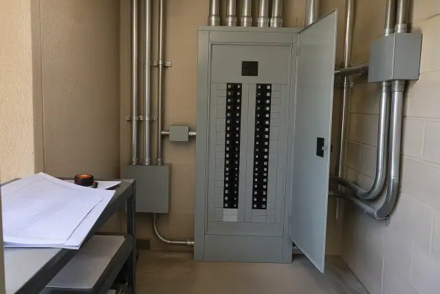 Industrial panelboard and conduit runs in a commercial utility closet in Phoenix, AZ.