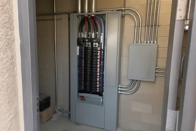 Commercial electrical panel upgrade with neat heavy-gauge wiring in a Peoria, AZ utility room.
