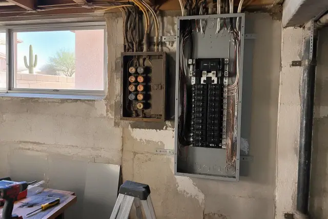 Outdated panel and fuse box replacement for a subpanel installation on a stucco exterior in Phoenix, AZ.