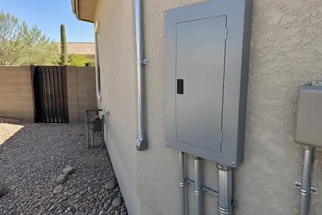 Replacing aging electrical panels for a 200 amp service upgrade in Phoenix, AZ.