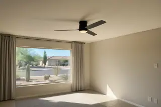 Modern ceiling fan installed on a living room ceiling in a Phoenix, AZ home.