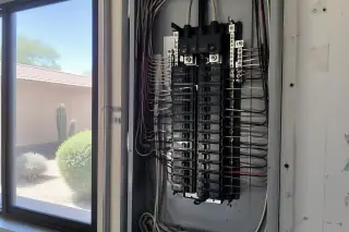 New circuit breaker installed in a residential electrical panel with desert views in Phoenix, AZ.