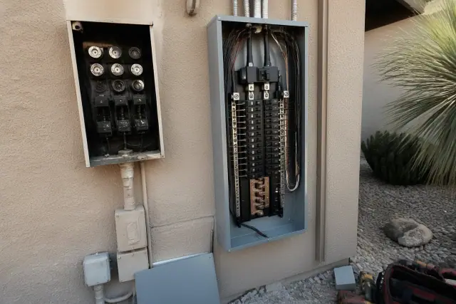 Electrical panel replacement on a stucco wall at a job site in Phoenix, AZ.