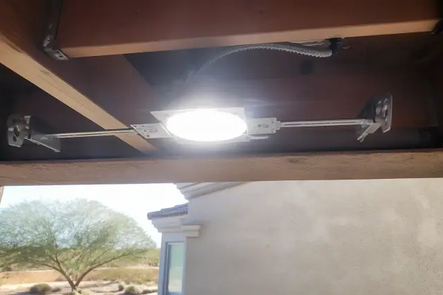 Exposed ceiling joist cavity and insulated wiring for recessed lighting at a jobsite in Phoenix, AZ.