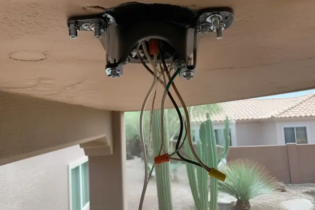 Mounting bracket and electrical wiring for a ceiling fan installation at a home in Phoenix, AZ.