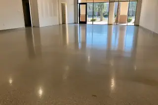 Polished concrete floor with aggregate detail reflecting desert light in a Phoenix, AZ retail space.
