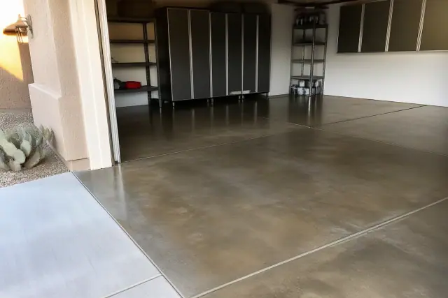 Finished epoxy flake garage flooring with stained concrete in a residential home in Phoenix, AZ.