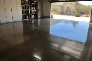 Stained and sealed concrete floor in a residential garage with desert views in Phoenix, AZ.