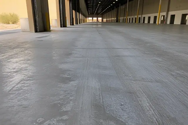 Diamond-ground concrete floor with visible grinding patterns in a warehouse in Phoenix, AZ.