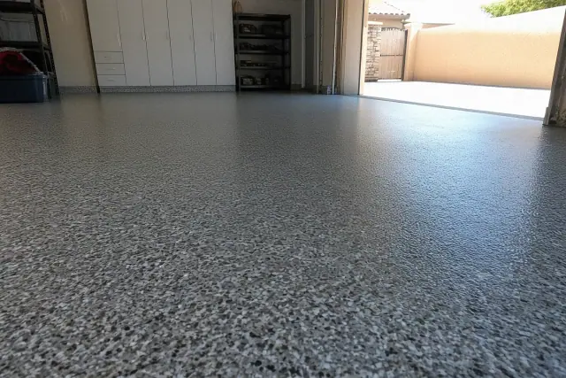 Epoxy flake flooring inside a residential garage in Phoenix, AZ, showing texture and color variation in natural light.