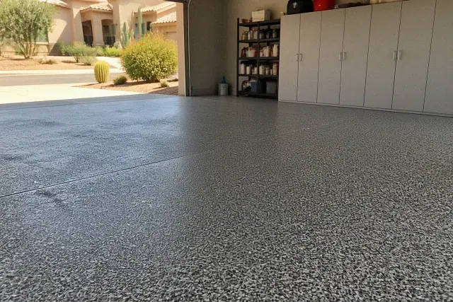 Completed epoxy flake flooring in a residential garage with desert views in Phoenix, AZ.