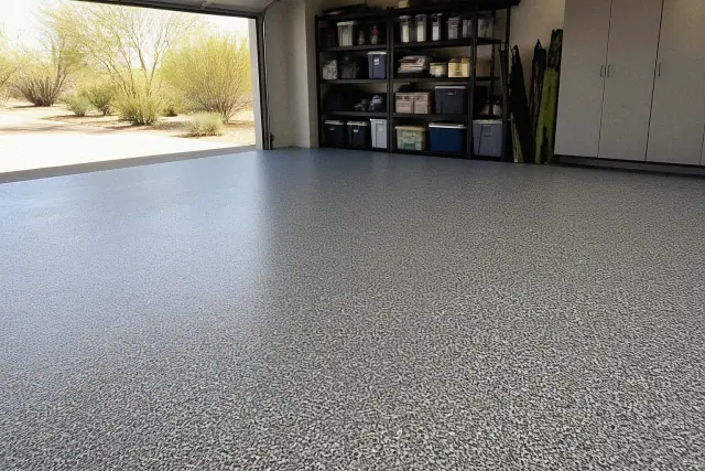 Epoxy flake floor in a residential garage with desert xeriscaping visible in Paradise Valley, AZ.