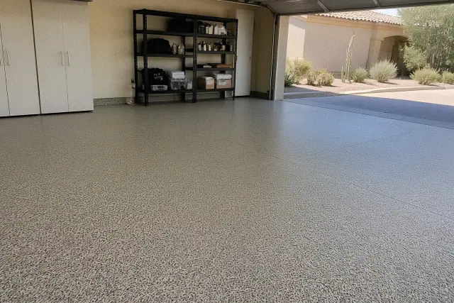 Epoxy flake flooring installed in a residential garage with desert landscaping visible in Tempe, AZ.
