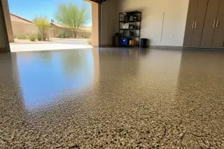 Multi-colored epoxy flake flooring inside a residential garage in Phoenix, AZ, with desert light and stucco walls.