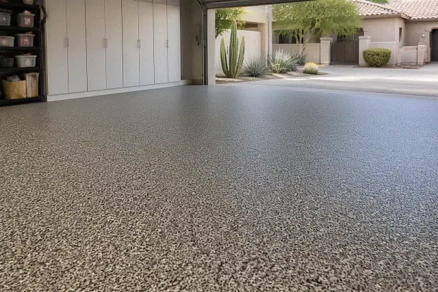 New epoxy flake flooring covering a residential garage floor in Phoenix, AZ, with desert landscaping visible outside.
