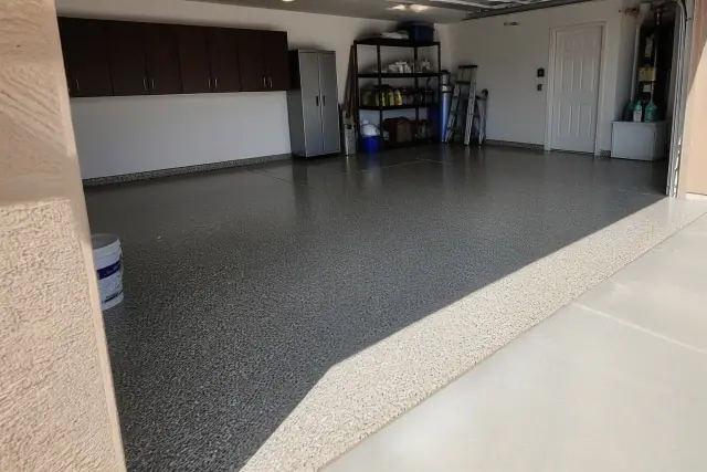 Finished epoxy garage floor with multi-colored resin flakes and a high-gloss finish in a Phoenix, AZ residence.
