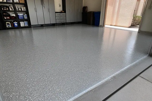 Glossy garage floor epoxy with decorative flakes in a residential garage in Phoenix, AZ.