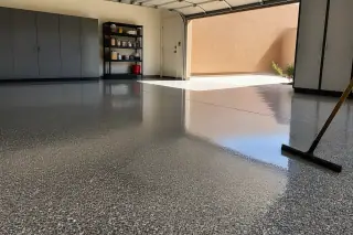 High-gloss epoxy floor with a squeegee in a residential garage in Phoenix, AZ.