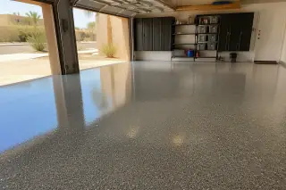 Finished epoxy garage floor with decorative flakes in a residential home in Phoenix, AZ.