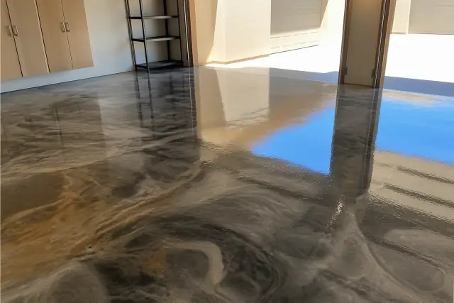 Metallic and hybrid epoxy garage floor with a high-gloss marbled finish in Phoenix, AZ.