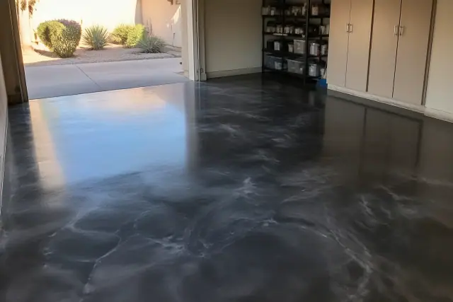 Metallic epoxy floor coating with swirling patterns in a residential garage in Phoenix, AZ.