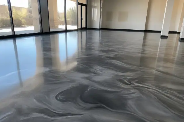 Cured metallic epoxy flooring in a retail space with desert sunlight visible through windows in Phoenix, AZ.