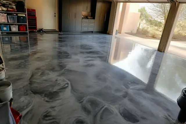 Metallic epoxy flooring with a marbled finish in a residential garage in Phoenix, AZ.