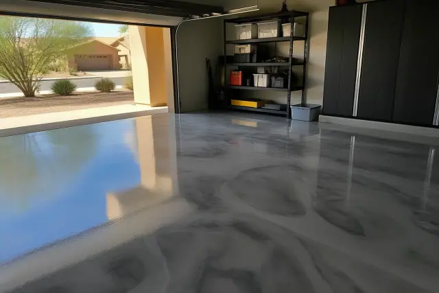 Completed metallic epoxy flooring in a residential garage in Glendale, AZ with views of desert xeriscaping outside.
