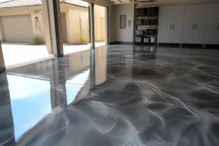 Swirling metallic epoxy floor in a residential garage with desert sunlight in Phoenix, AZ.