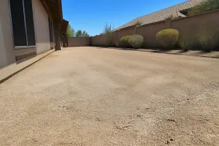 Cleanly swept gravel subgrade after concrete removal at a construction site in Phoenix, AZ.