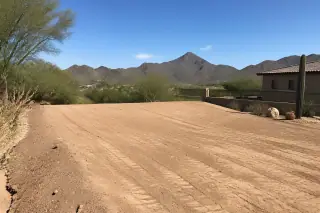 Leveled dirt pad with xeriscaping and desert mountain views in Phoenix, AZ.