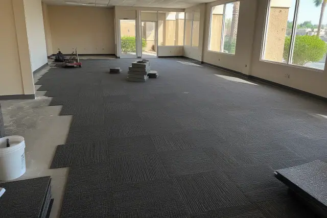 Commercial carpet tile installation in a workspace during an interior renovation in Mesa, AZ.