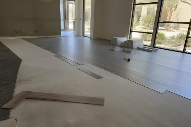 Installation of luxury vinyl plank flooring in a commercial office space in Phoenix, AZ.