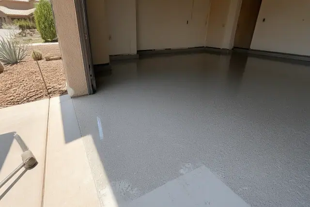 Freshly applied high-gloss epoxy coating on a garage concrete floor at a job site in Phoenix, AZ.