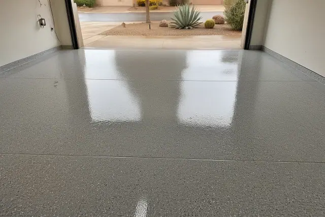 Glossy epoxy floor with decorative flakes in a residential garage in Scottsdale, AZ.