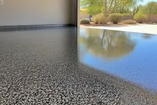 High-gloss epoxy floor with metallic flecks and desert landscape view in a Phoenix, AZ garage.