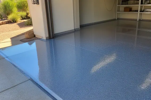 High-gloss epoxy resin being applied to a concrete garage floor at a jobsite in Phoenix, AZ.