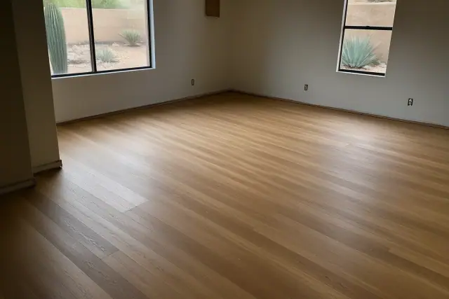 Refinished hardwood bedroom floor with matte sealer and visible wood grain in a Phoenix, AZ home.