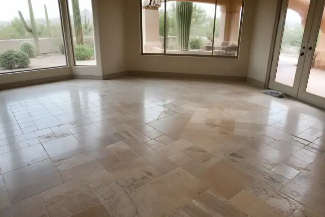 Natural stone and marble tile flooring in a Phoenix, AZ dining area with desert landscape visible through the windows.