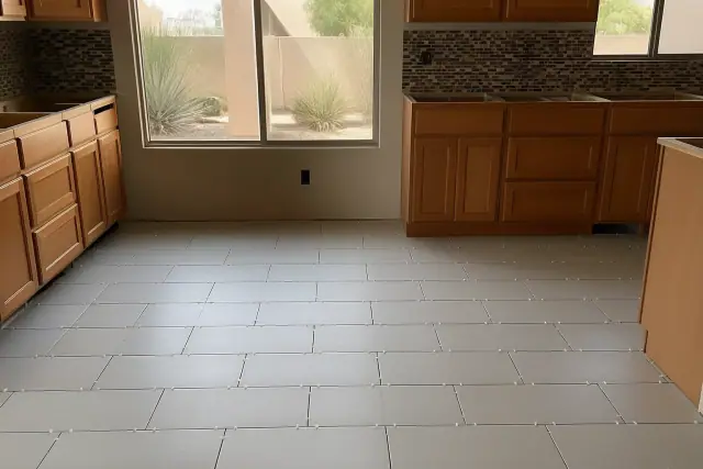 New subway, glass, and mosaic tile flooring with installation spacers in a kitchen in Phoenix, AZ.