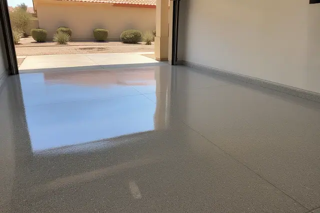 Glossy industrial epoxy flooring installed on a warehouse concrete slab in Phoenix, AZ.