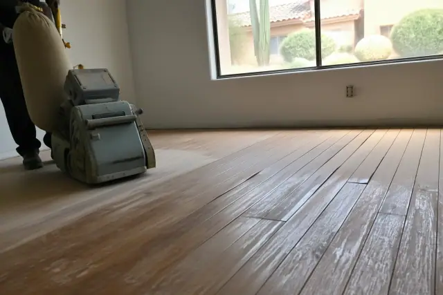 Water cupping on hardwood floor planks during a restoration project in Phoenix, AZ.