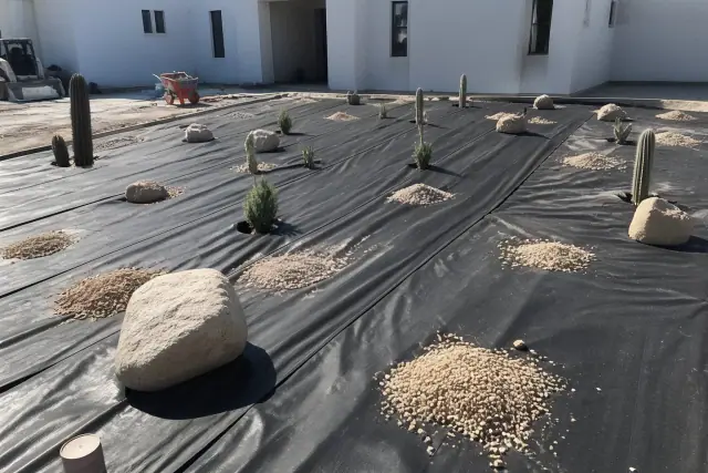 Weed barrier fabric and crushed granite on a desert landscaping project site in Phoenix, AZ.
