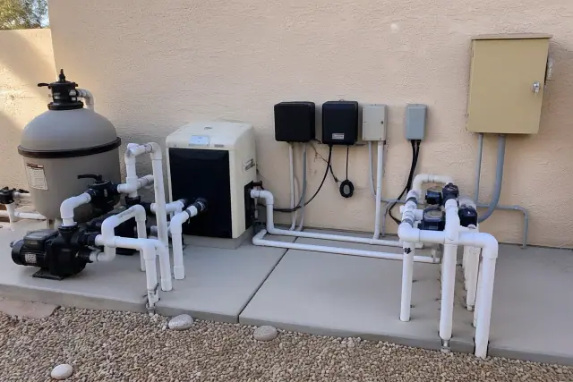 Pool heater, salt cell, and control panel installation on an equipment pad in Phoenix, AZ.