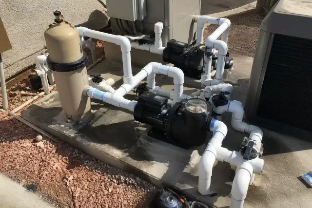 Variable-speed pool pump conversion with new PVC plumbing on a concrete slab in Phoenix, AZ.