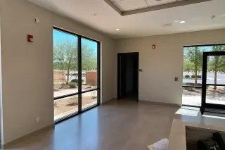 Fire alarm horn-strobe and pull station in a commercial office lobby in Phoenix, AZ.